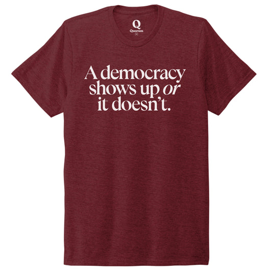 "A democracy shows up or it doesn't." Quorum Unisex Tri-Blend Tee editorial print in Vino Red