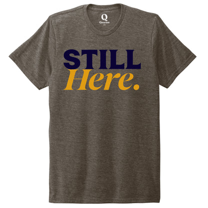 "Still Here." Quorum Unisex Tri-Blend Tee front print in Earthy Brown