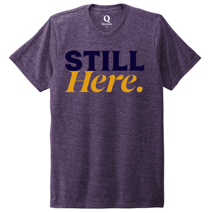 "Still Here." Quorum Unisex Tri-Blend Tee front print in Huckleberry