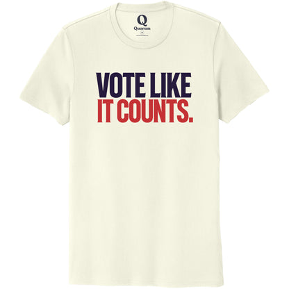 "Vote like it counts." Quorum Unisex 100% Organic Cotton Tee front print in White Sand