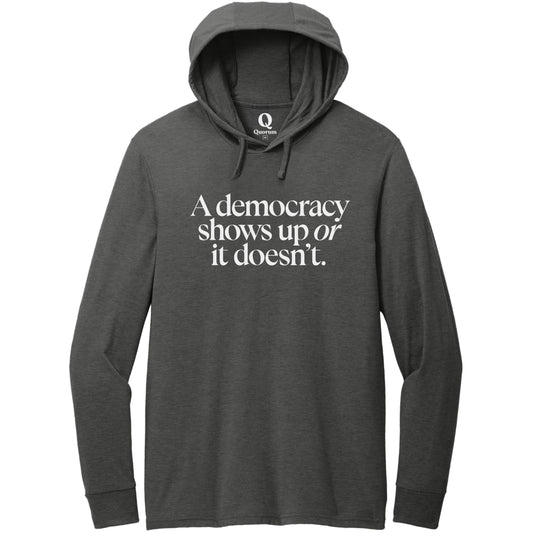 "A democracy shows up or it doesn't." Quorum Tri-Blend Hoodie Tee editorial print in Space Black