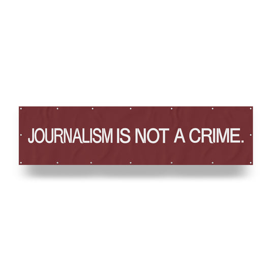 "Journalism is Not a Crime." — Quorum vinyl banner