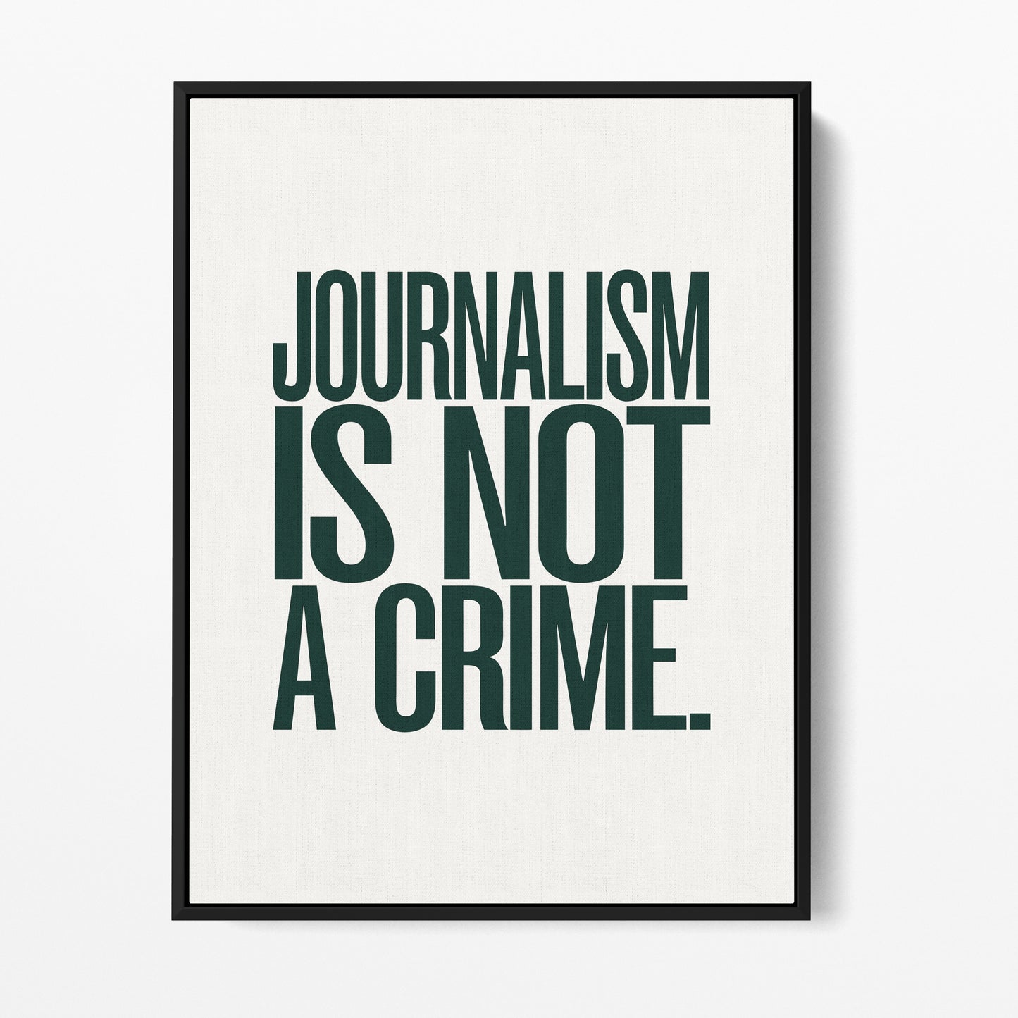 Journalism Is Not a Crime — Quorum framed gallery canvas in black hardwood floater frame, portrait orientation
