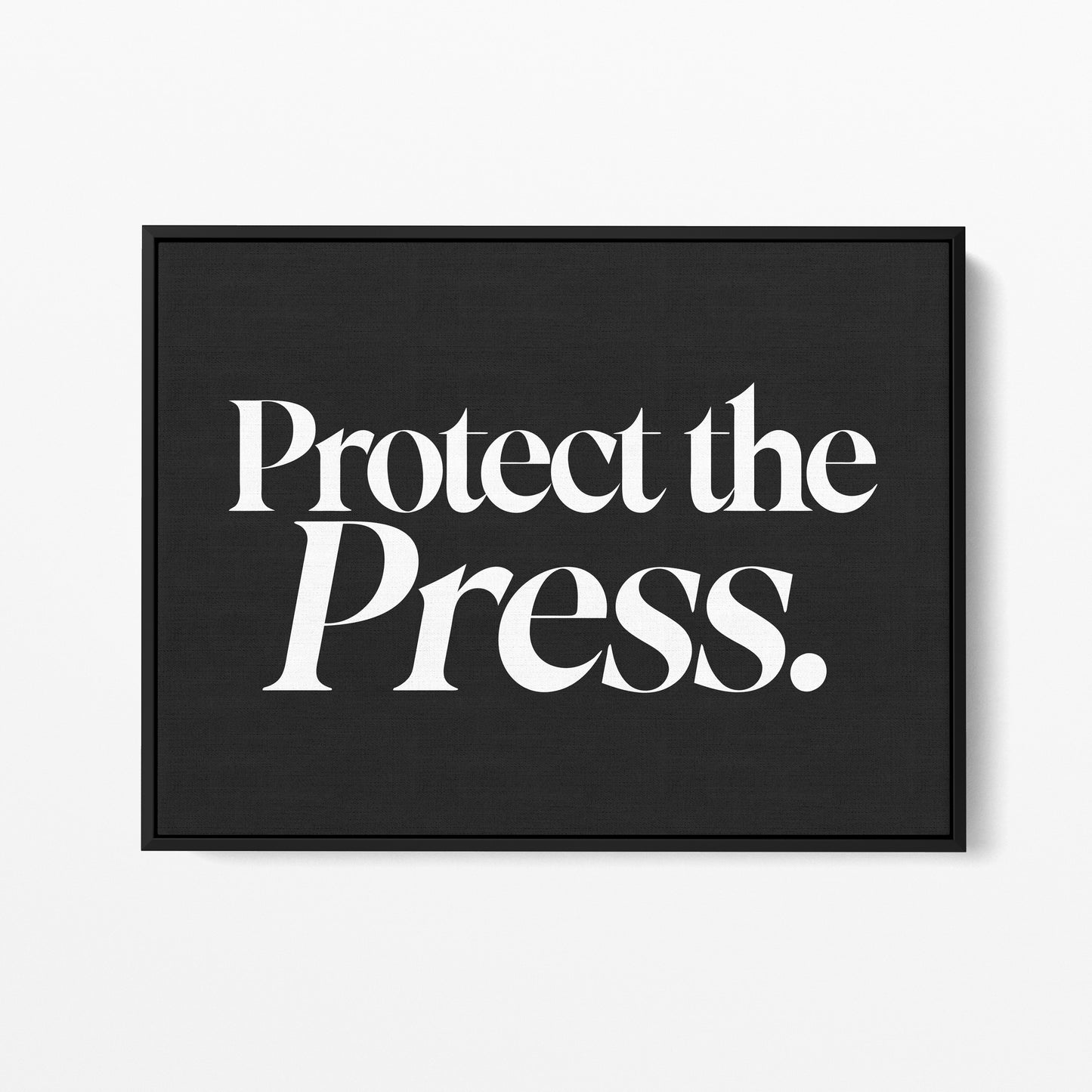 Protect the Press — Quorum framed gallery canvas in black hardwood floater frame, landscape orientation