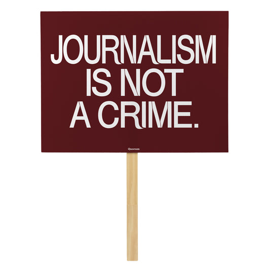 Journalism Is Not a Crime rally sign — Quorum