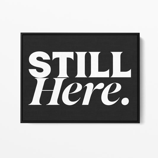 Still Here — Quorum framed gallery canvas in black hardwood floater frame, landscape orientation